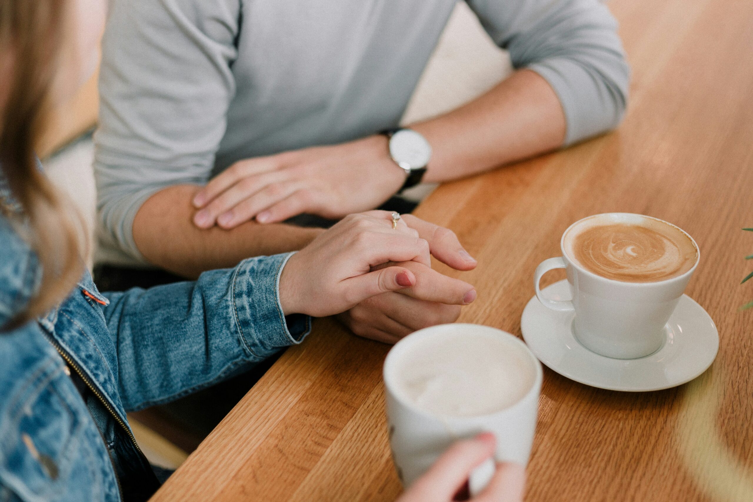 Couple communicating over coffee